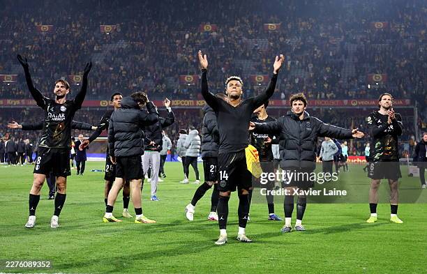 Désiré Doué of Paris Saint-Germain celebrate the Ligue 1 championship victory with Fabian Ruiz and Joao Neves after the Ligue 1 McDonald's match...