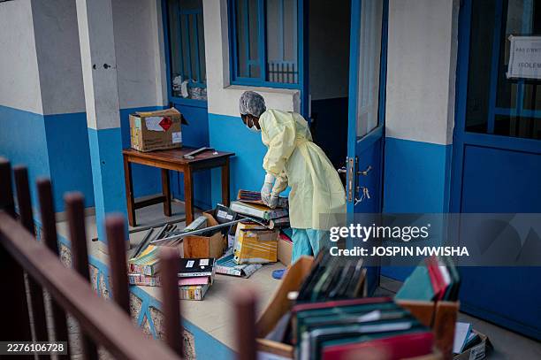 Staff members at CBCA Virunga Hospital prepare rooms intended for possible suspected Ebola cases following official announcements in Goma, on May 17,...