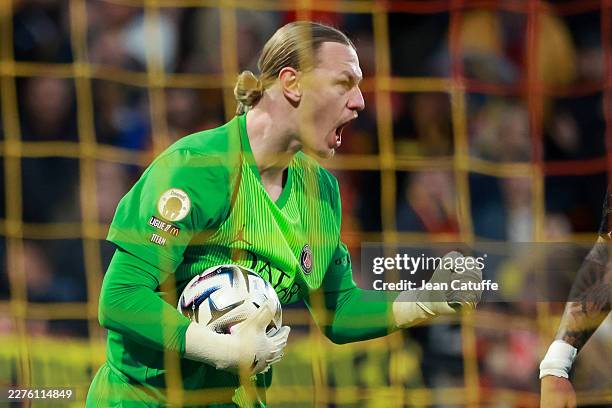 Goalkeeper Matvey Safonov celebrates a save during the Ligue 1 McDonald's football match between RC Lens and Paris Saint-Germain at Stade...
