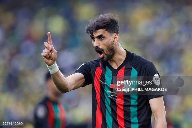 S Moroccan defender Marwan Louandi reacts during the CAF Champions League final first leg football match between Mamelodi Sundowns and AS FAR at...