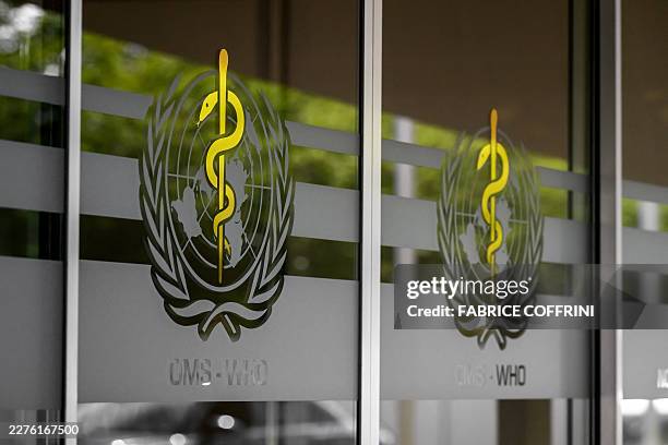 This photograph shows the logo of the World Health Organization on the entrance of their headquarters ahead of the 79th World Health Assembly in...