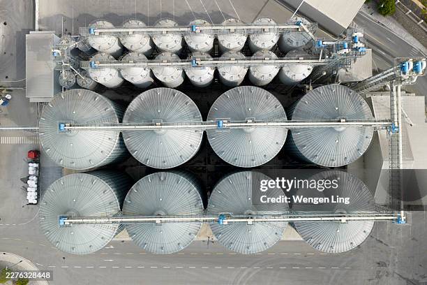 aerial view of the factory's raw material storage facilities - silo stock pictures, royalty-free photos & images