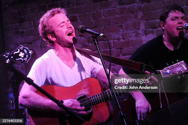 American Folk & Bluegrass musicians Dave Simonett , on acoustic guitar, and Tim Saxhaug, on bass guitar, both of the group Trampled by Turtles,...