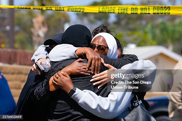 San Diego, CA On Monday, May 18, 2026 in San Diego, CA., not from the Islamic Center of San Diego, several people embrace one another. Five dead,...