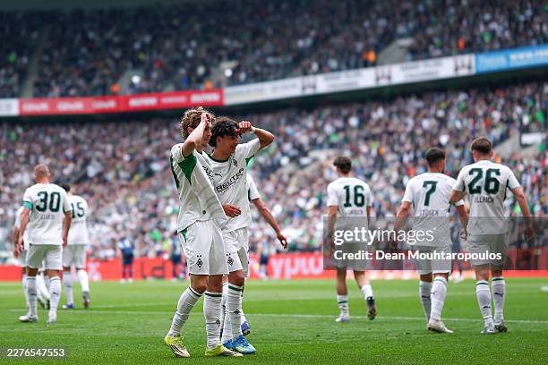 Hugo Bolin of Borussia Monchengladbach celebrates scoring his team's first goal with teammates during the Bundesliga match between Borussia...