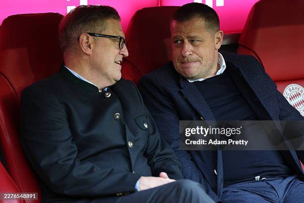 Jan-Christian Dreesen, CEO of Bayern Munich, speaks with Max Eberl, Sporting CEO of FC Bayern Munich, prior to the Bundesliga match between FC Bayern...