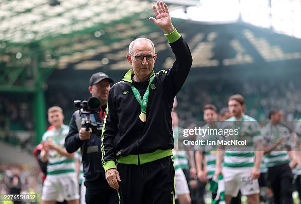 Martin O'Neill, Interim Manager of Celtic acknowledges the fans following the team's victory in the William Hill Premiership match between Celtic and...