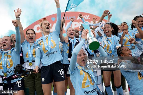 Alex Greenwood of Manchester City lifts the Barclays Women's Super League trophy following the Barclays Women's Super League match between West Ham...