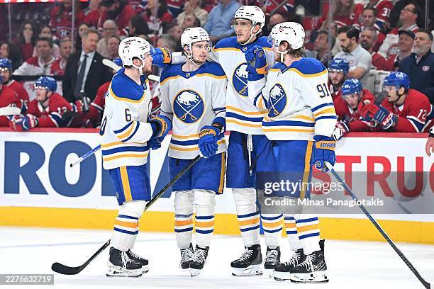 Jack Quinn of the Buffalo Sabres celebrates with teammates after scoring a power play goal during the third period against the Montréal Canadiens in...