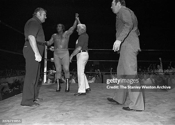 View of unidentified professional wrestlers in a match in Houston, Texas on June 10, 1977.