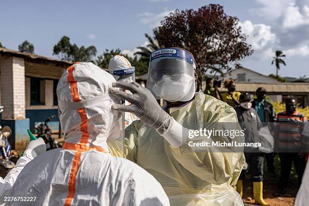 Workers don protective equipment at the General Referral Hospital of Mongbwalu during the Ebola outbreak response in Mongbwalu, Ituri province,...