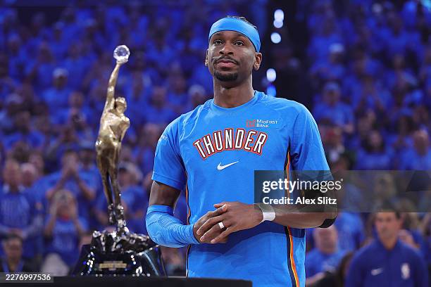 Shai Gilgeous-Alexander of the Oklahoma City Thunder looks on before being presented with the Michael Jordan Trophy after being named the NBA's most...