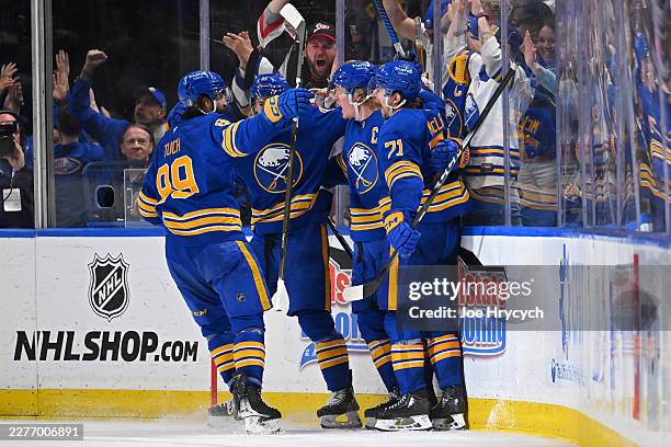 Rasmus Dahlin of the Buffalo Sabres celebrates with teammates after scoring a goal against the Montréal Canadiens during the third period in Game...