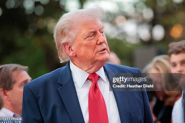 President Donald Trump greets guests during the Congressional picnic on the South Lawn of the White House on May 19, 2026 in Washington, DC. The...