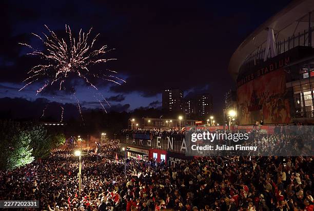 Arsenal fans celebrate winning the Premier League after Manchester City failed to win away to Bournemouth at Emirates Stadium on May 19, 2026 in...
