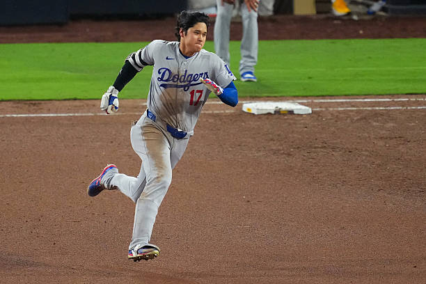 Shohei Ohtani of the Los Angeles Dodgers runs after hitting a double during the eighth inning against the San Diego Padres at Petco Park on May 19,...