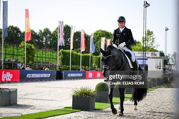 Belgian rider Justin Verboomen and his horse Zonik Plus pictured after his competition at the Dressage Nations Cup FEI CDIO4 equestrian event in...