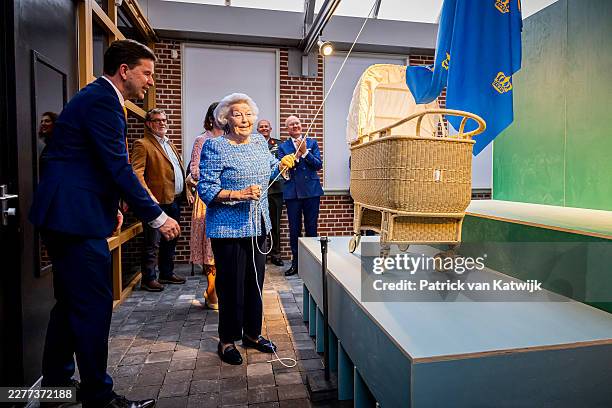 Princess Beatrix of the Netherlands looks at her own wicker cradle during the visit to The National Basketry Museum on May 20, 2026 in Noordwolde,...