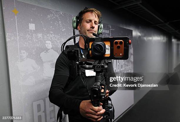 Cameraman uses an iPhone 17 Pro smartphone to take general views of locker rooms prior to a live broadcast of a soccer match between the Los Angeles...