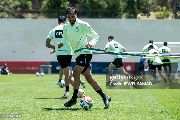 Jordan's forward Mousa Al-Tamari controls the ball during a training session with his teammates at the Nashama Training Centre in Amman on May 24...