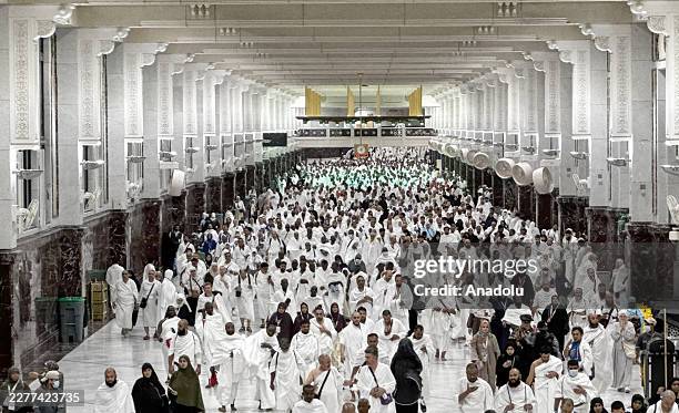 Muslim pilgrims from various countries around the world who come to perform the Hajj, circumambulate the Masjid al-Haram wearing Ihram during the...