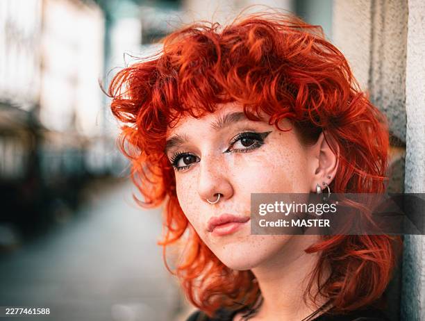 candid young woman on city street - pierced stock pictures, royalty-free photos & images