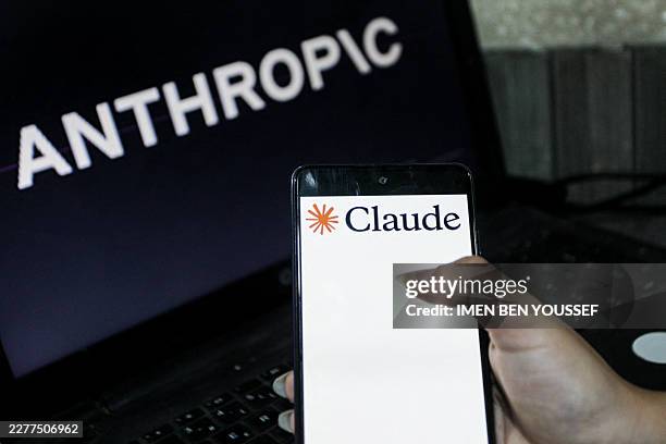 Illustration photo showing the Claude logo displayed on a smartphone and the Anthropic logo on a computer screen, highlighting the growing...