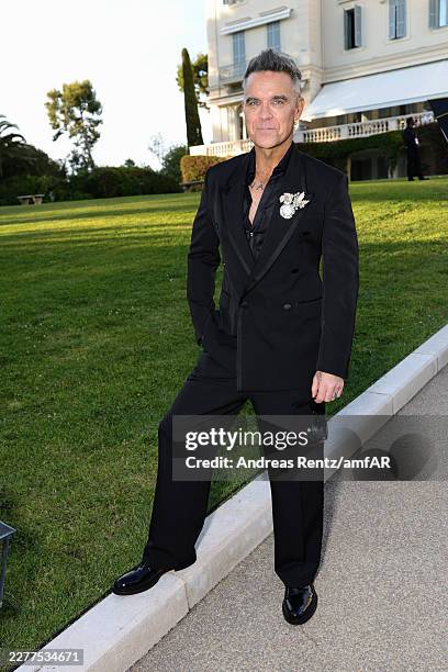 Robbie Williams attends the amfAR Gala Cannes 2026 presented by Chopard at Hotel du Cap-Eden-Roc on May 21, 2026 in Cap d'Antibes, France.