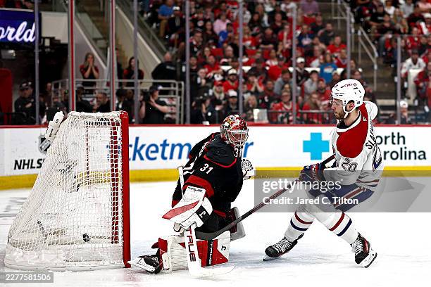 Juraj Slafkovsky of the Montreal Canadiens scores a goal against Frederik Andersen of the Carolina Hurricanes during the third period in Game One of...