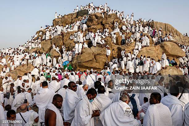 Muslim pilgrims pray on Saudi Arabia's Mount Arafat, also known as Jabal al-Rahma or Mount of Mercy, during the climax of the Hajj pilgrimage early...
