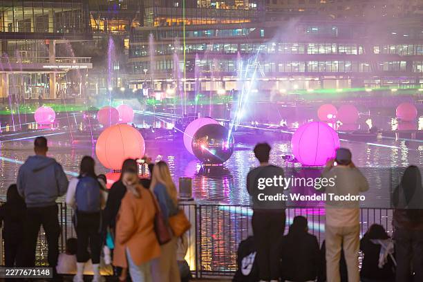 Crowds gather at Darling Harbour to watch a laser show as Vivid Sydney kicks off on May 22, 2026 in Sydney, Australia. Vivid Sydney is an annual...