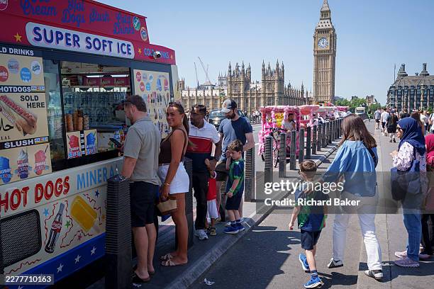 As record-breaking spring temperatures continue in the capital, visitors buy ice creams on Westminster Bridge, on 26th May 2026, in London, England....