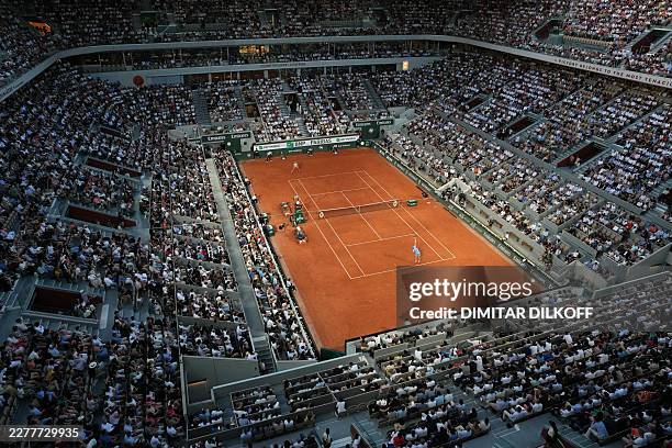 Italy's Jannik Sinner serves to France's Clement Tabur during their men's singles match on day 3 of the French Open tennis tournament on Court...