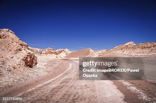 Road through the famous Valle the la Luna near San Pedro de Atacama in Chile Road through the famous Valle the la Luna near San Pedro de Atacama in Chile