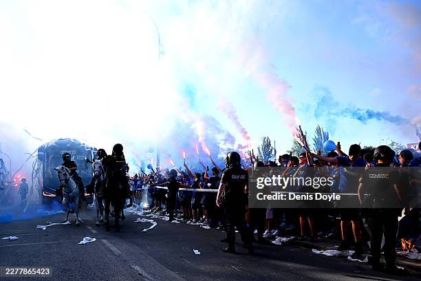 Fans light flares as the Getafe CF team bus arrives at the stadium prior to the LaLiga EA Sports match between Getafe CF and CA Osasuna at Coliseum...