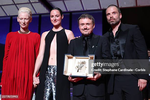 Tilda Swinton, Renate Reinsve, Cristian Mungiu - winner of Palme D'or for "Fjord and Sebastian Stan on stage during the closing ceremony of the 79th...