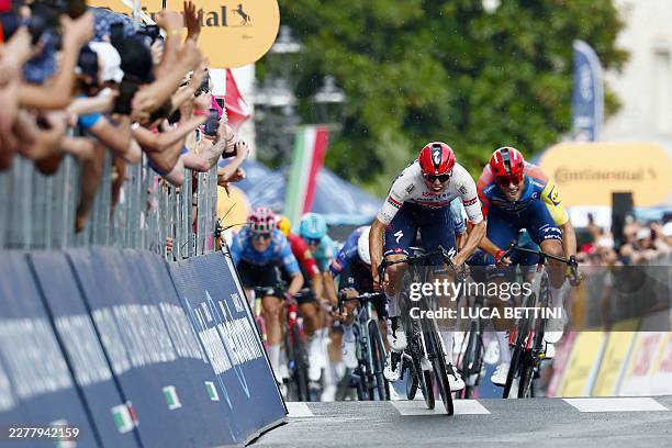 Soudal Quick-Step French rider Paul Magnier sprints next to Bahrain - Victorious Italian rider Edoardo Zambanini and Lidl - Trek Italian rider...