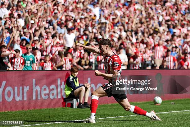 Trai Hume of Sunderland celebrates scoring his team's first goal during the Premier League match between Sunderland and Chelsea at the Stadium of...