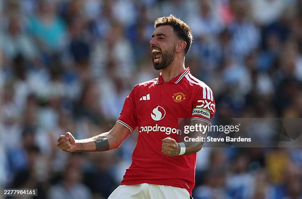 Bruno Fernandes of Manchester United celebrates scoring his team's third goal during the Premier League match between Brighton & Hove Albion and...