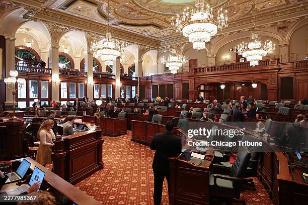 State representatives work in the House chamber during the spring legislative session at the Illinois Capitol on May 27 in Springfield, Illinois.