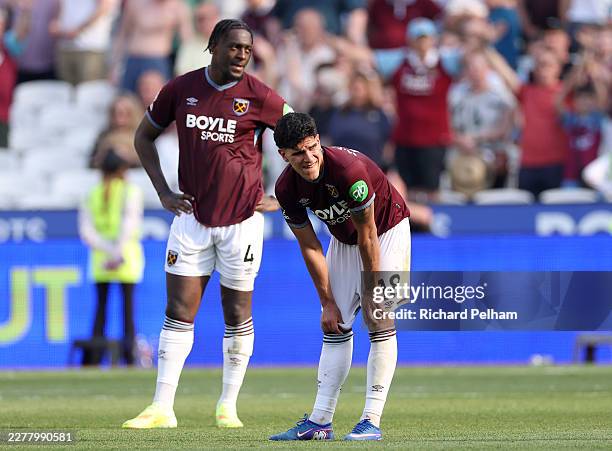 Axel Disasi and Mateus Fernandes of West Ham United look dejected after the Premier League match between West Ham United and Leeds United at the...
