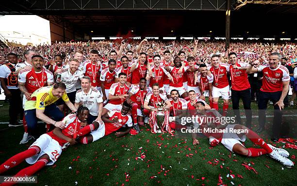 Players of Arsenal celebrate with the Premier League trophy, as Arsenal are crowned the Champions of the Premier League for the 2025/26 Season, after...