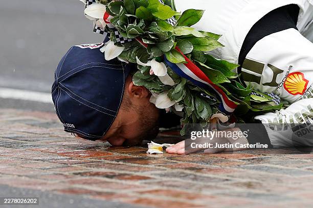 Felix Rosenqvist, driver of the Meyer Shank w/ Curb-Agajanian Honda celebrates by kissing the yard of bricks after winning the NTT IndyCar Series...