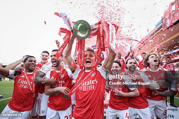 Martin Odegaard of Arsenal lifts the Premier League trophy during the Premier League match between Crystal Palace and Arsenal at Selhurst Park on May...