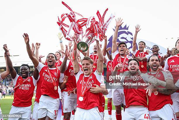 Martin Odegaard of Arsenal lifts the Premier League trophy during the Premier League match between Crystal Palace and Arsenal at Selhurst Park on May...