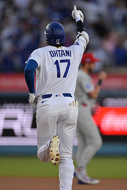 Shohei Ohtani of the Los Angeles Dodgers rounds the bases after hitting a solo home run in the third inning against the Philadelphia Phillies at...