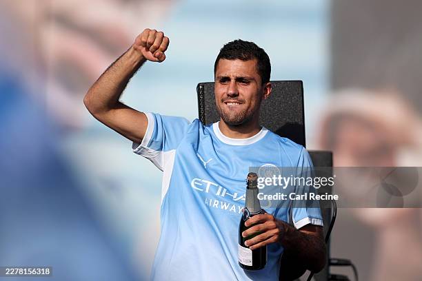 Rodri of Manchester City celebrates from the bus during the Manchester City Parade And After Party Celebration to mark the achievements of Manchester...