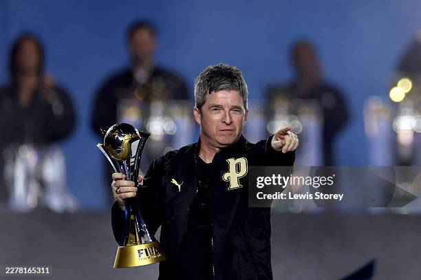 Oasis band member Noel Gallagher brings out the 2023 FIFA Club World Cup trophy during the After Party Celebration to mark the achievements of...