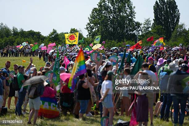 Demonstrators queue to form a large human wind turbine as they take part in a demonstration under the motto "Future instead of gas Together for the...