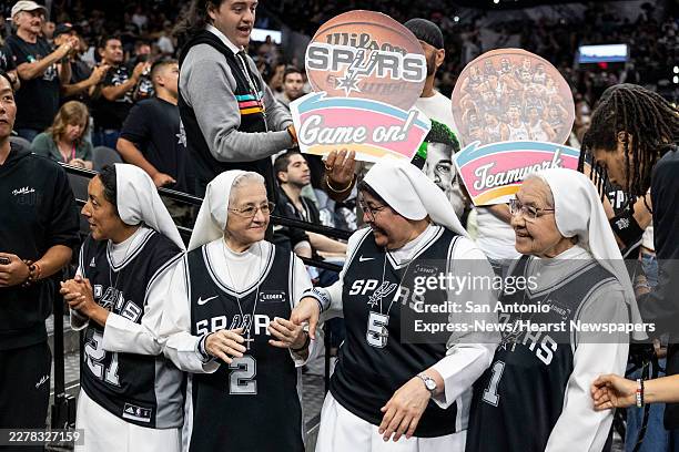 Salesian Sisters of St. John Bosco on San Antonio's West Side wait for players during Game 4 of the Western Conference Finals at Frost Bank Center in...